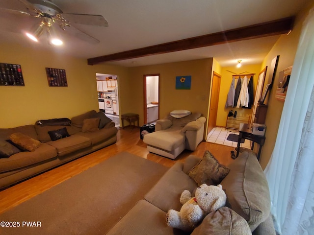 188 Forest Ridge Dr, Hawley, PA 18428 - living room featuring beamed ceiling, wood finished floors, and ceiling fan