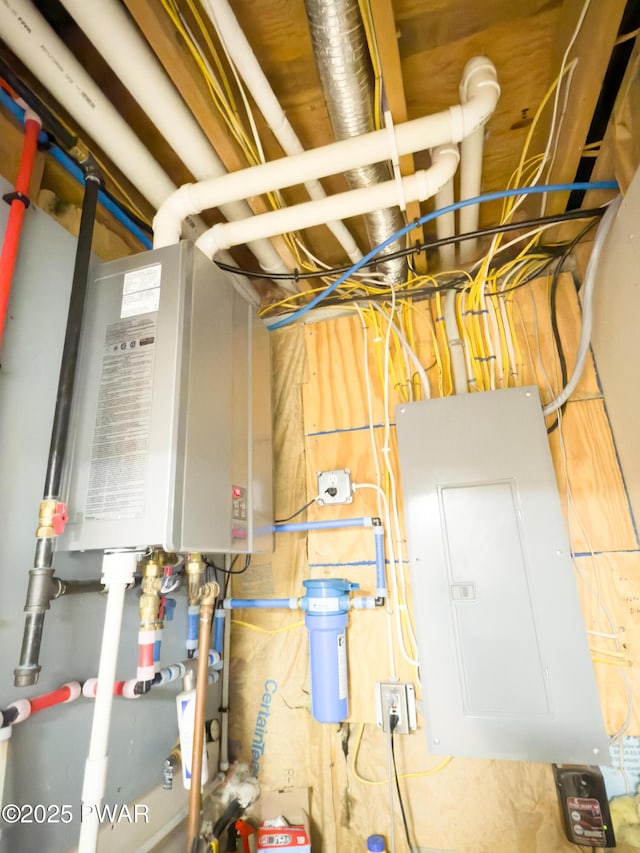 utility room with tankless water heater and electric panel