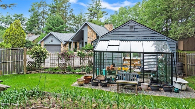 122 Waterfront Dr, Greentown, PA 18426 - fenced backyard with an exterior structure and an outbuilding