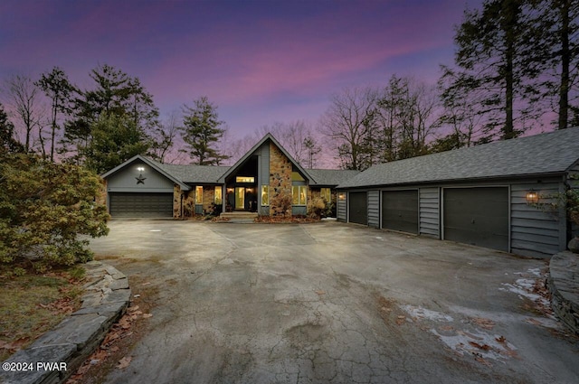 122 Waterfront Dr, Greentown, PA 18426 - mid-century inspired home featuring asphalt driveway, a garage, and a shingled roof