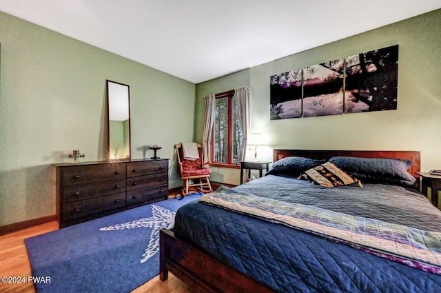 bedroom featuring wood-type flooring