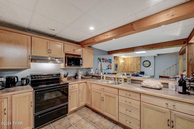 kitchen with beamed ceiling, sink, light brown cabinets, and black appliances