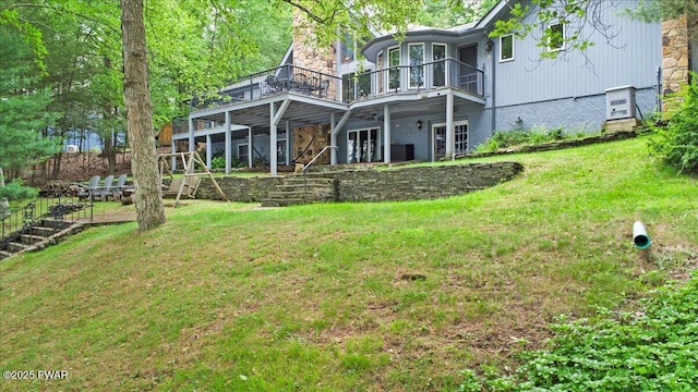 122 Waterfront Dr, Greentown, PA 18426 - back of property with a wooden deck, a lawn, a chimney, and french doors