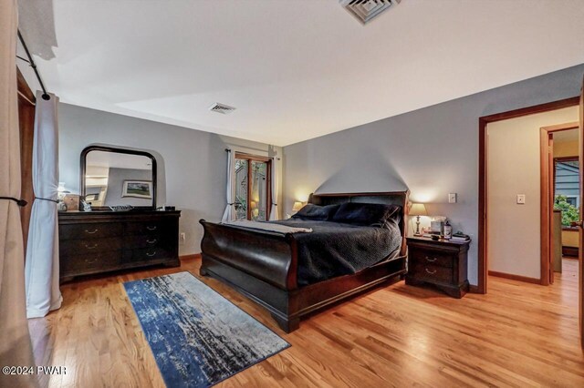 bedroom with light wood-type flooring