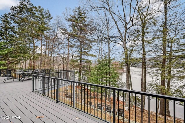 wooden terrace with a water view