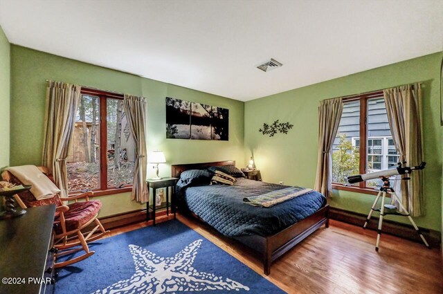 bedroom with hardwood / wood-style flooring