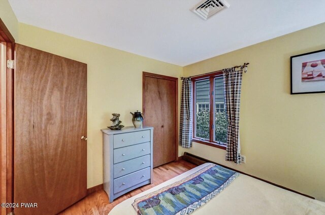 bedroom with light hardwood / wood-style flooring