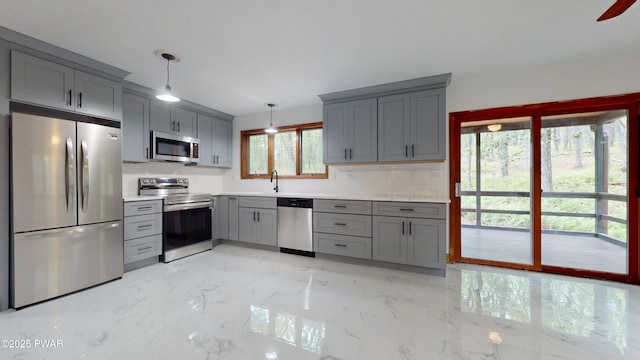 158 Wild Meadow Dr, Milford, PA 18337 - kitchen with appliances with stainless steel finishes, gray cabinetry, light countertops, and pendant lighting