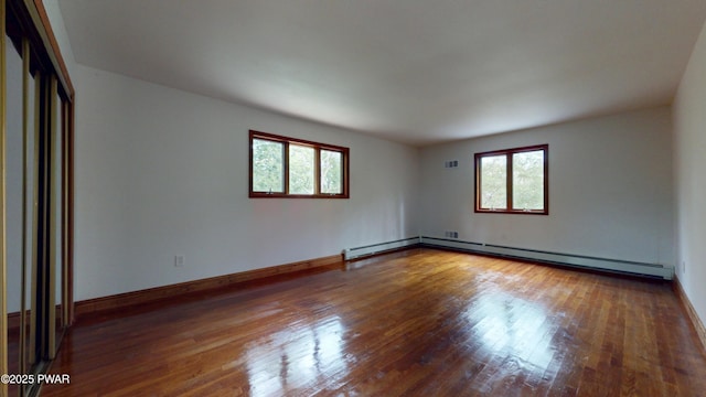 158 Wild Meadow Dr, Milford, PA 18337 - unfurnished room featuring healthy amount of natural light, wood finished floors, and baseboard heating