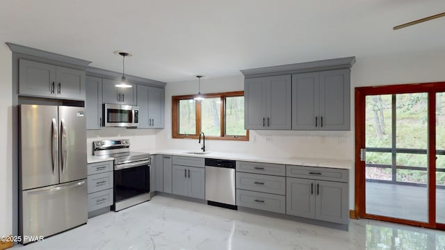 158 Wild Meadow Dr, Milford, PA 18337 - kitchen with stainless steel appliances, gray cabinetry, light marble finish flooring, light countertops, and hanging light fixtures
