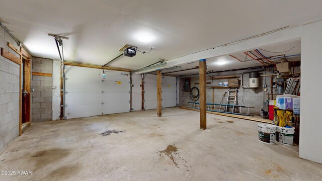 158 Wild Meadow Dr, Milford, PA 18337 - garage featuring a garage door opener, concrete block wall, and electric panel