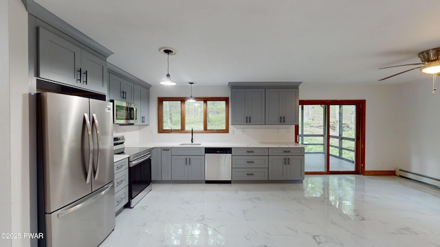 158 Wild Meadow Dr, Milford, PA 18337 - kitchen featuring stainless steel appliances, gray cabinetry, light marble finish flooring, and light countertops