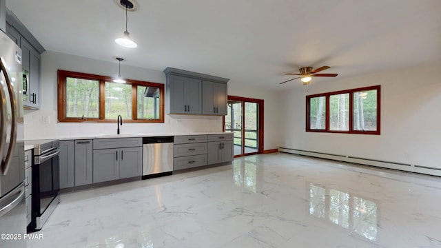 158 Wild Meadow Dr, Milford, PA 18337 - kitchen with gray cabinetry, appliances with stainless steel finishes, a baseboard heating unit, light marble finish flooring, and light countertops