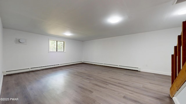 158 Wild Meadow Dr, Milford, PA 18337 - empty room with baseboard heating and wood finished floors