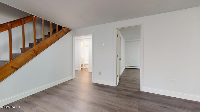 158 Wild Meadow Dr, Milford, PA 18337 - empty room with baseboard heating, wood finished floors, and stairs