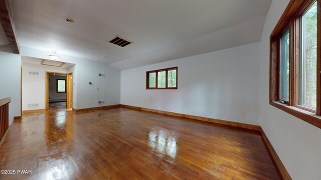 158 Wild Meadow Dr, Milford, PA 18337 - empty room featuring wood finished floors, attic access, and lofted ceiling