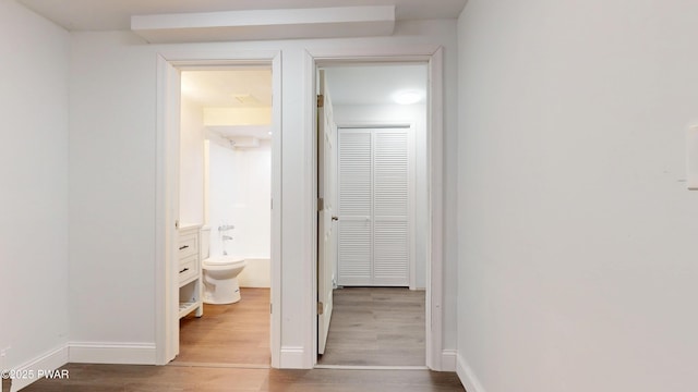 158 Wild Meadow Dr, Milford, PA 18337 - hallway featuring wood finished floors and baseboards