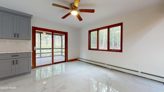 158 Wild Meadow Dr, Milford, PA 18337 - unfurnished dining area with a baseboard heating unit, light marble finish floors, and a ceiling fan