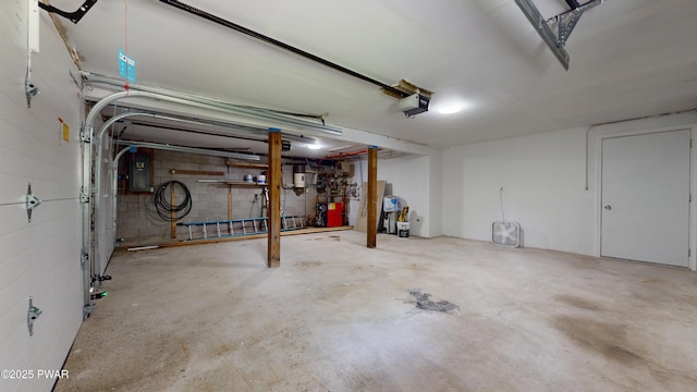 158 Wild Meadow Dr, Milford, PA 18337 - garage with electric panel, a garage door opener, and concrete block wall