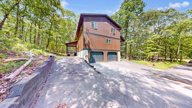 158 Wild Meadow Dr, Milford, PA 18337 - view of side of property featuring driveway and an attached garage