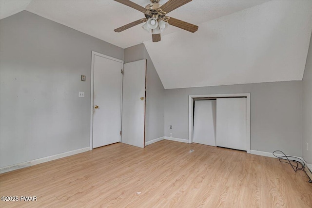 additional living space with lofted ceiling, ceiling fan, and light hardwood / wood-style flooring