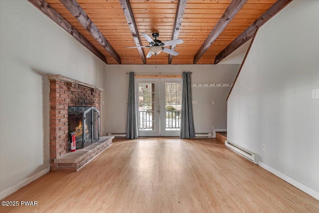 unfurnished living room featuring beamed ceiling, wood ceiling, baseboard heating, light wood-type flooring, and french doors