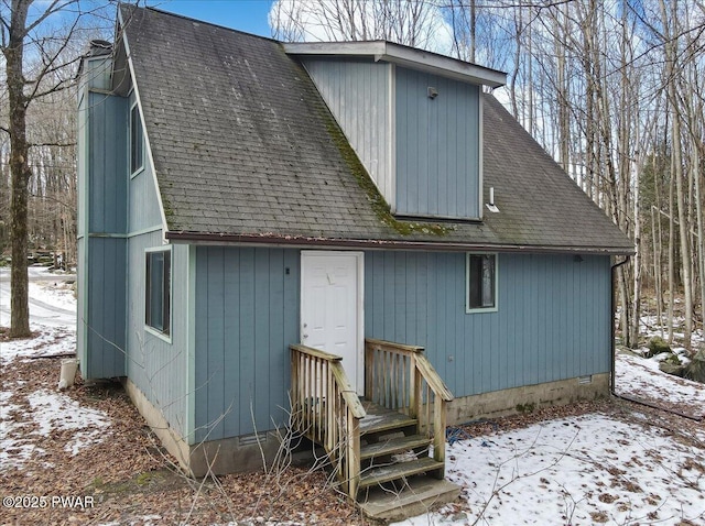 view of snow covered house