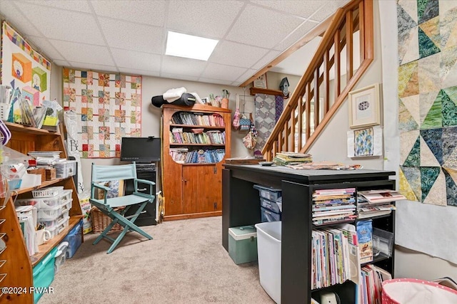 carpeted office featuring a drop ceiling