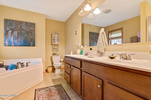 bathroom with a bathing tub, tile patterned flooring, vanity, and toilet