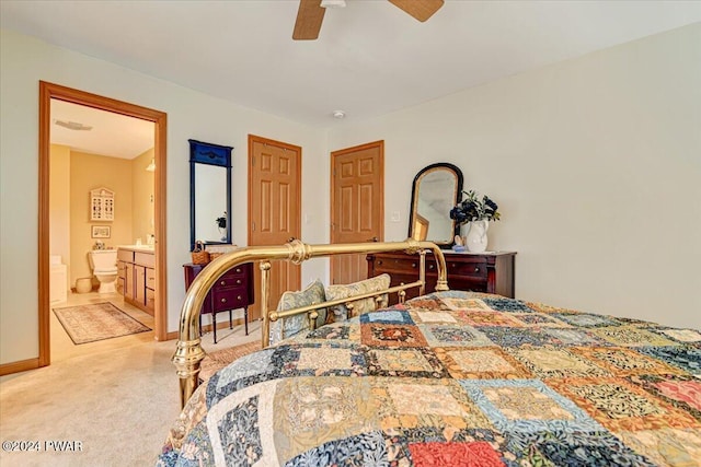 carpeted bedroom featuring ceiling fan and connected bathroom