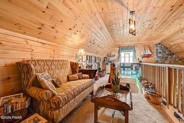 sitting room with lofted ceiling, wood walls, wooden ceiling, and carpet floors