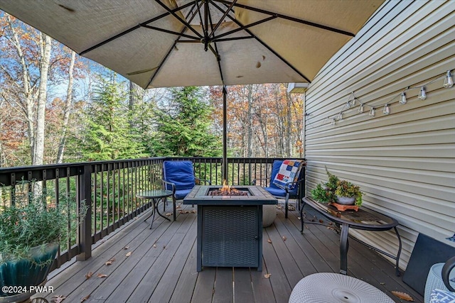 deck featuring an outdoor fire pit