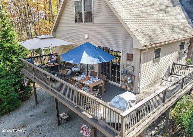 wooden deck featuring area for grilling