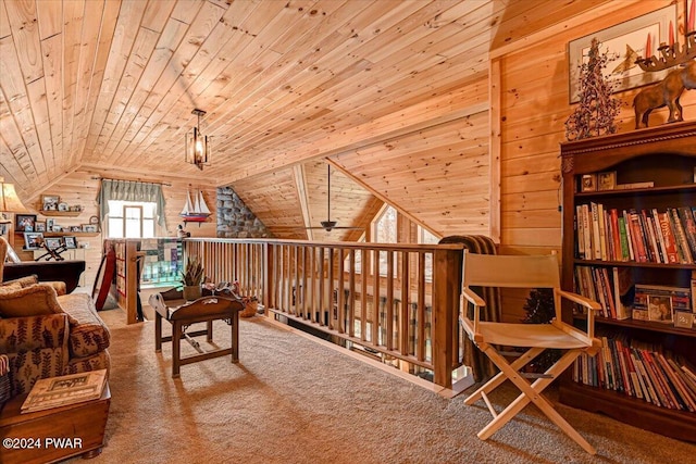 living area with carpet, ceiling fan, wooden ceiling, and vaulted ceiling