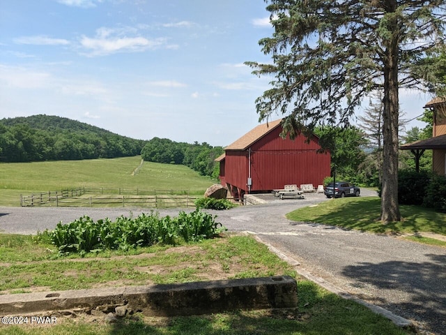 exterior space with a mountain view and a rural view