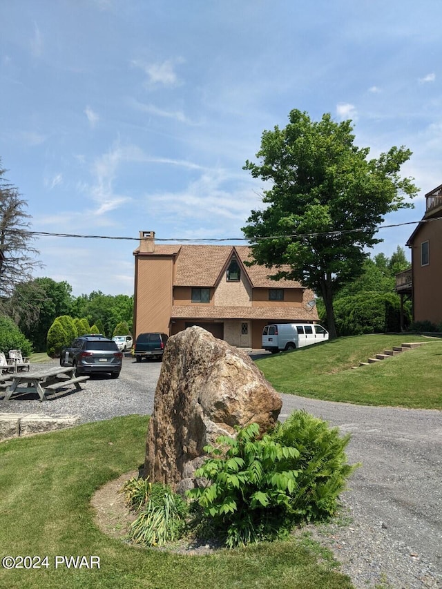 view of front of home with a front lawn