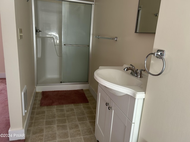 bathroom with vanity and walk in shower