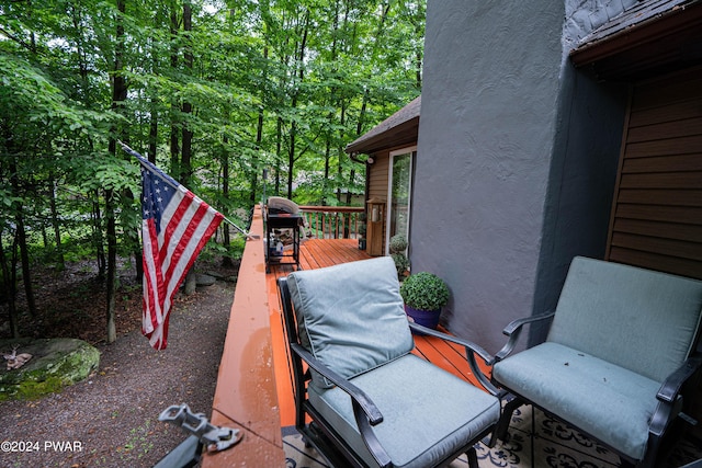 view of patio featuring area for grilling and a wooden deck