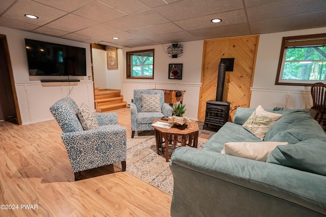 70 Underwood Ln, Lake Ariel, PA 18436 - living room featuring hardwood / wood-style flooring, a paneled ceiling, and a wood stove