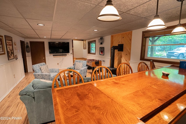 dining space with wood-type flooring