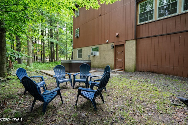 view of yard featuring a patio and a hot tub