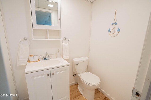 70 Underwood Ln, Lake Ariel, PA 18436 - bathroom with hardwood / wood-style floors, vanity, and toilet