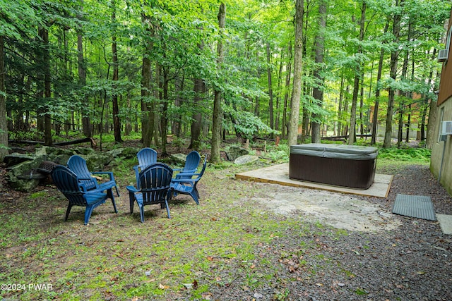 view of yard with a patio and a hot tub