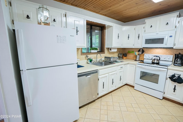 kitchen featuring white appliances, sink, light tile patterned floors, wooden ceiling, and white cabinets