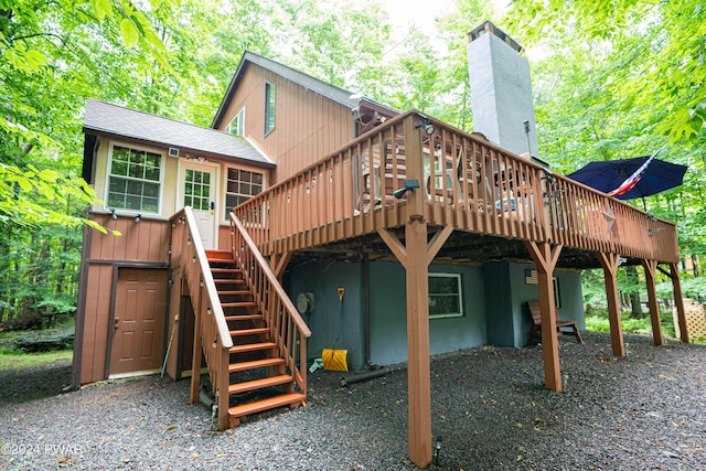 back of house with a wooden deck