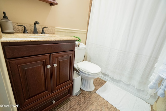 full bathroom featuring vanity, toilet, and shower / bathtub combination with curtain