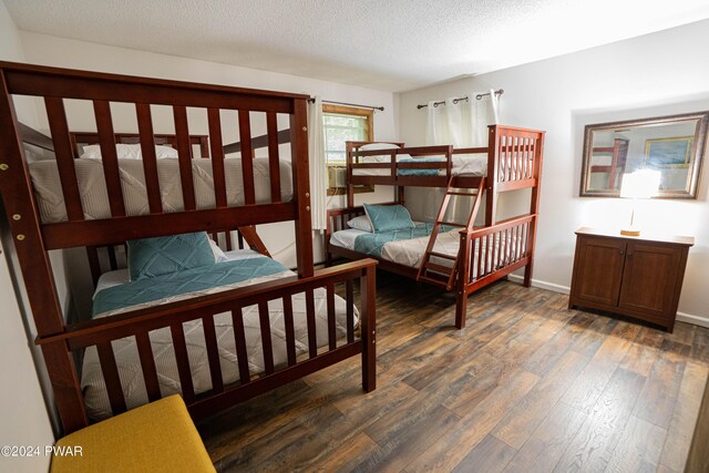 70 Underwood Ln, Lake Ariel, PA 18436 - bedroom with a textured ceiling and dark wood-type flooring