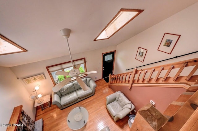 105 Chestnut Ct, Lackawaxen, PA 18435 - living room with vaulted ceiling, wood finished floors, and a skylight
