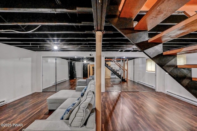 105 Chestnut Ct, Lackawaxen, PA 18435 - basement featuring stairway, a baseboard radiator, wood finished floors, baseboard heating, and baseboards