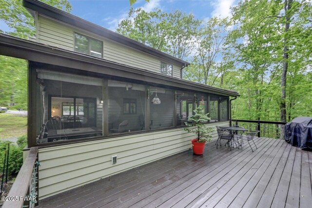 105 Chestnut Ct, Lackawaxen, PA 18435 - wooden terrace with a sunroom, outdoor dining area, and area for grilling